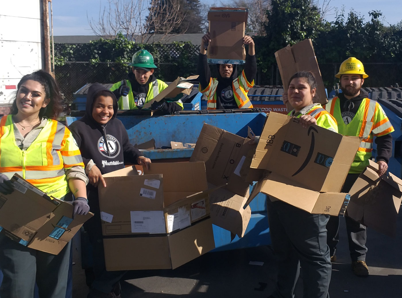 ZWSV staff members breaking down cardboard boxes. 