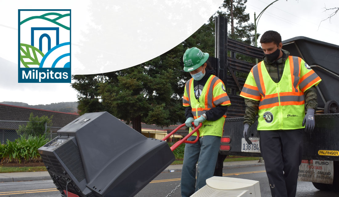 Corpsmembers loading e-waste onto a truck with City of Milpitas logo